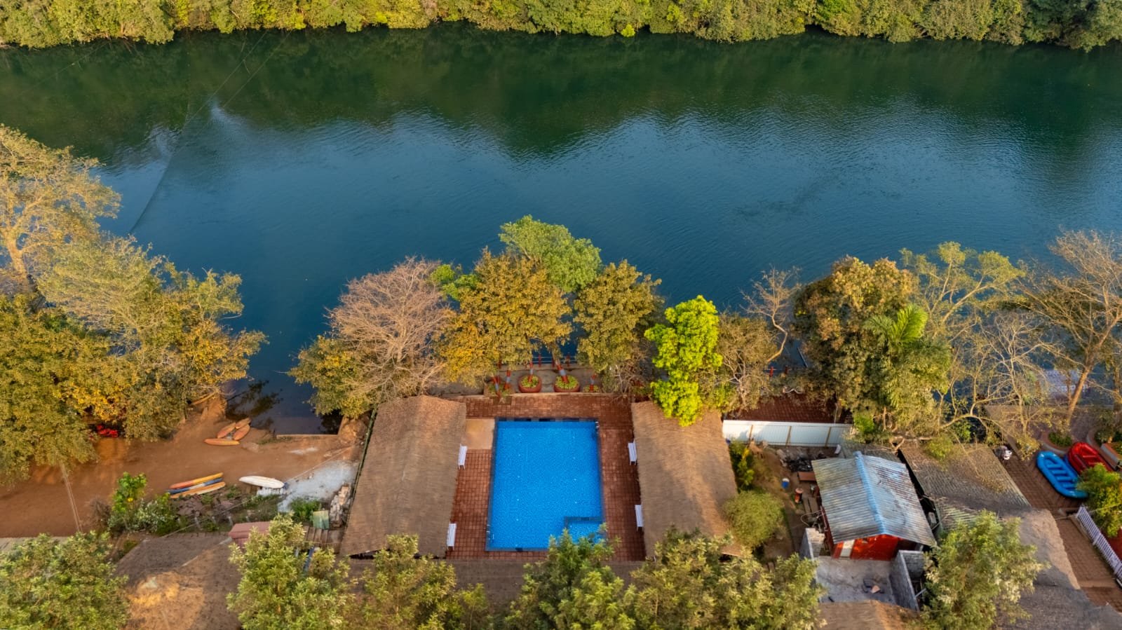 Aerial drone view of Nadi Teera Dandeli riverside cottage resort