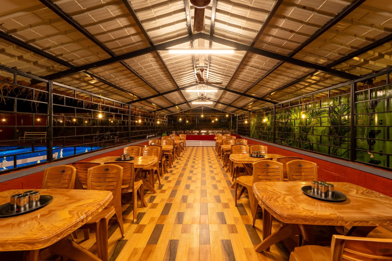 Nadi Teera Dandeli dining hall with buffet seating area