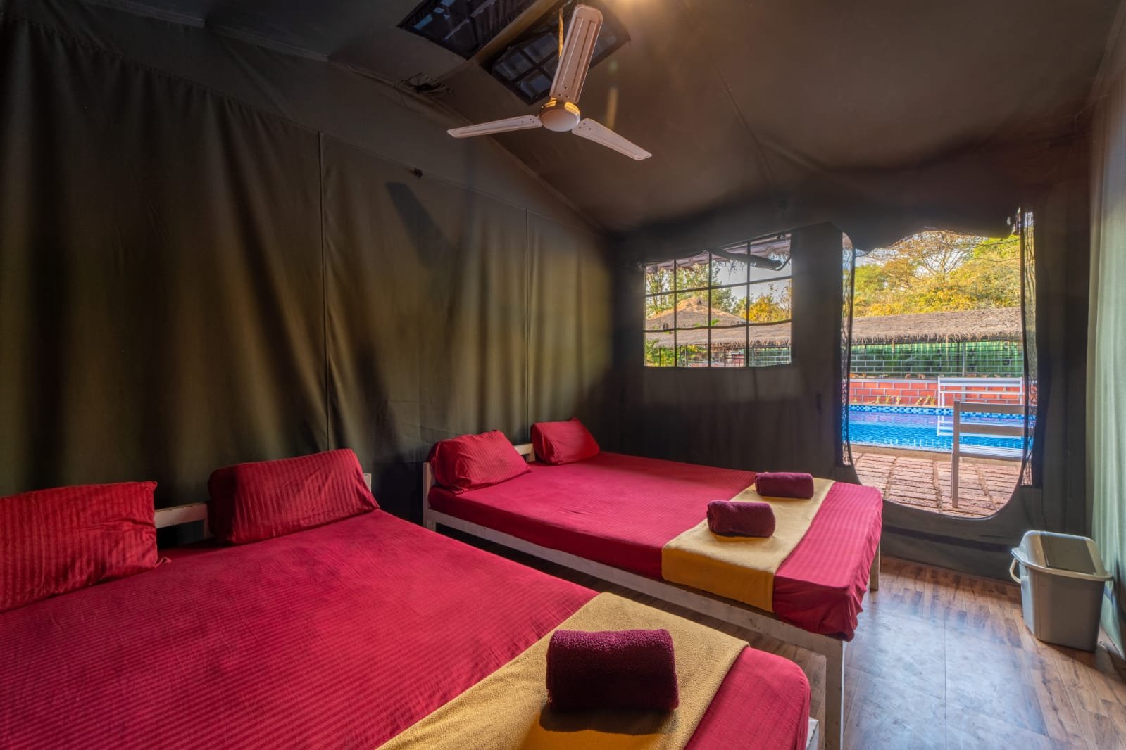 Commando tent interior at Nadi Teera Dandeli with pool view